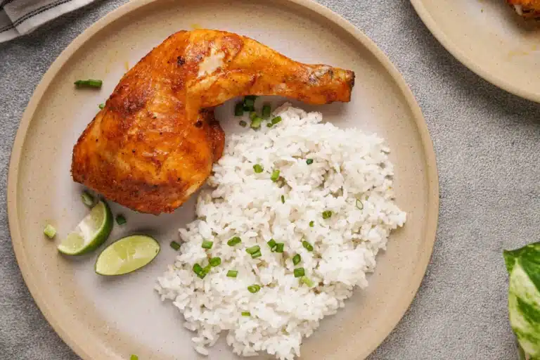A plate with tandoori chicken and white rice, included on a weekly meal planning spreadsheet.