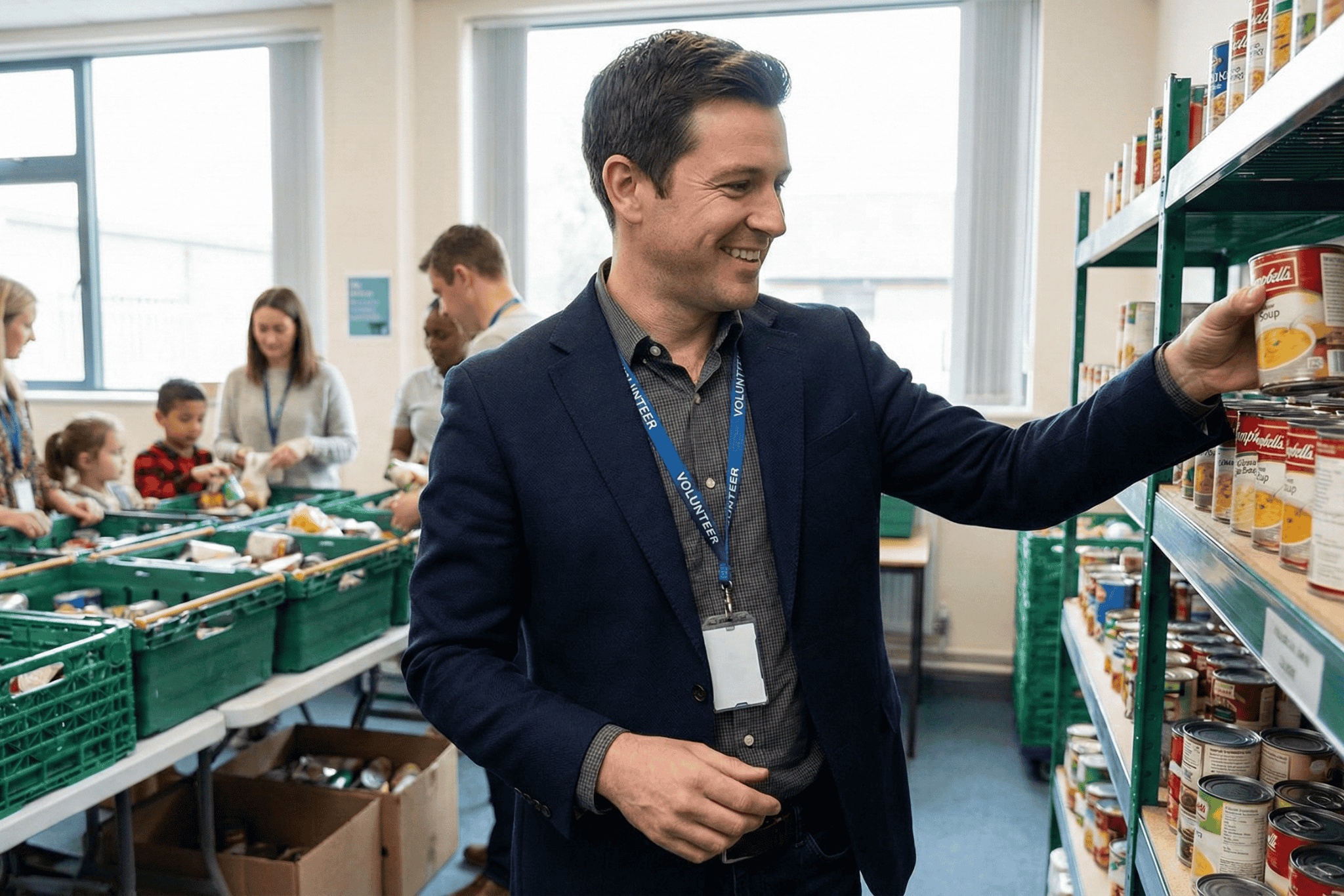 A well dressed man in a food bank holding a can.