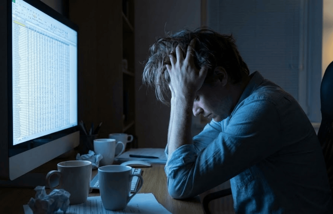 A frustrated user looking at a spreadsheet.